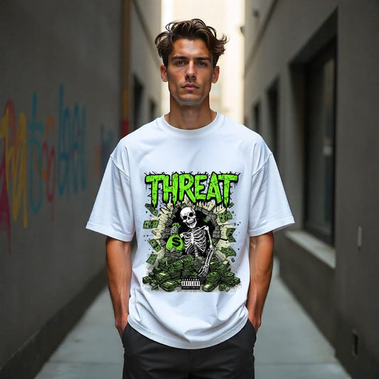 Man wearing a white t-shirt with a graphic design and the word 'THREAT' in a narrow alley.
