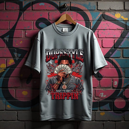 Gray t-shirt with graphic design and text on a graffiti-covered wall background