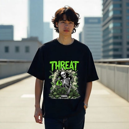 Person wearing a black t-shirt with a graphic design and 'THREAT' text on a rooftop with cityscape background