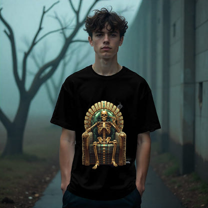 Person wearing a black t-shirt with a skeleton on a throne graphic in a foggy outdoor setting.