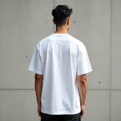 Person wearing a plain white t-shirt against a neutral background