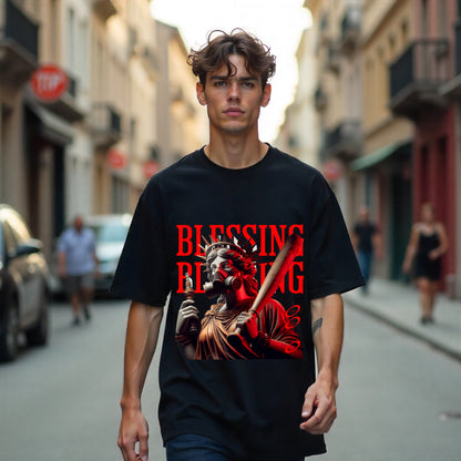 Person wearing a black t-shirt with a graphic design on a city street