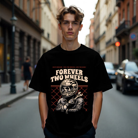 Person wearing a black t-shirt with 'Forever Two Wheels' graphic on a city street.