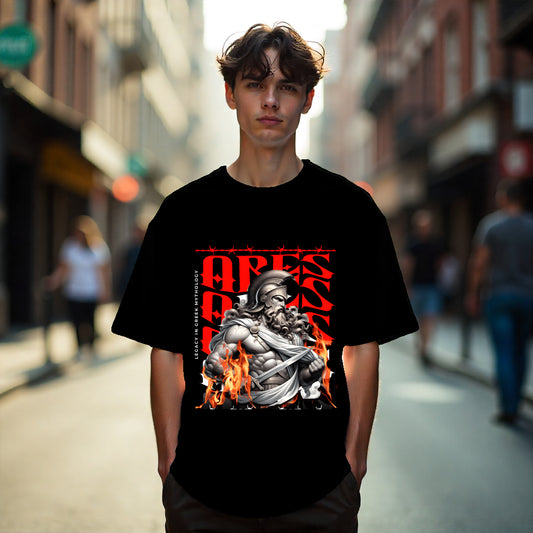 Person wearing a black t-shirt with a graphic design on a city street