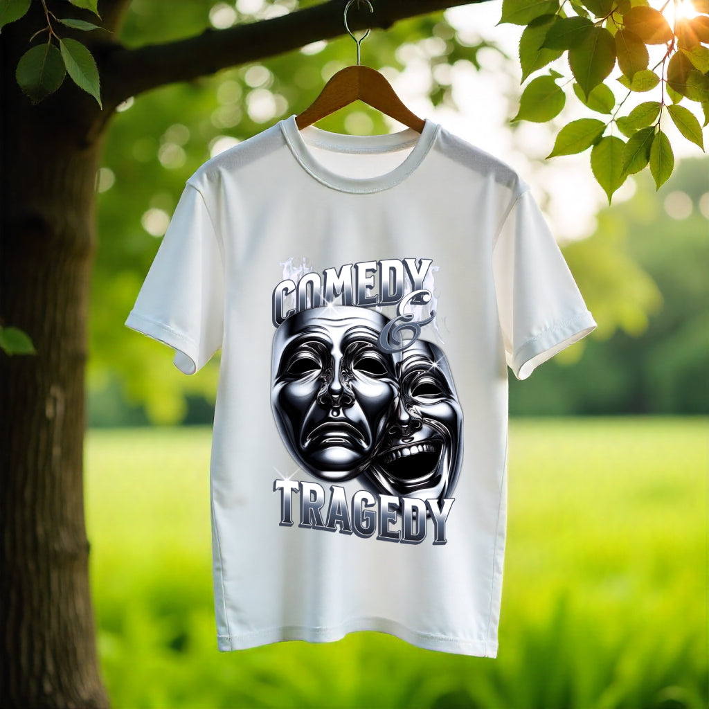 White t-shirt with 'Comedy & Tragedy' design hanging on a wooden hanger against a natural background.